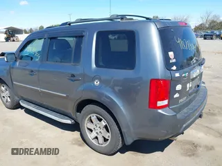 2011 Honda Pilot Touring with VIN 5FNYF4H95BB090892, listed as a IAAI auction lot 41878404 with 131,757 mi miles. Bid and sale history available at carsss.com. Image 3.
