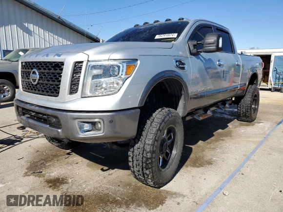 2017 Nissan Titan XD SV with VIN 1N6BA1F4XHN521471, listed as a Copart auction lot 76291024 with 100,447 mi miles and Salvage Title. Bid and sale history available at carsss.com. Image 1.