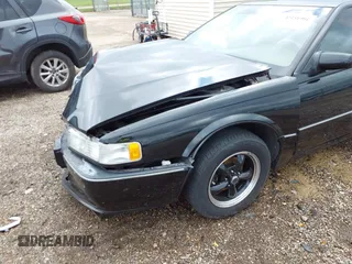 1994 Cadillac Seville STS z VIN 1G6KY5296RU823387, wystawiony jako IAAI lot #42151901 z przebiegiem 165 918 mil mil oraz . Historia ofert i sprzedaży dostępna na DreamBid. Obrazek 6.