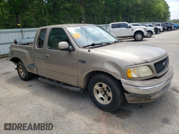 2003 Ford F-150 XL with VIN 1FTRX07213KD96765, listed as a Copart auction lot 53745465 with 292,863 mi miles and Salvage title. Bid and sale history available at DreamBid. Image 4.