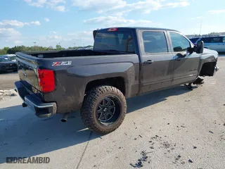 2015 Chevrolet Silverado 1500 LT with VIN 3GCUKREC0FG504717, listed as a IAAI auction lot 41668156 with 79,641 mi miles. Bid and sale history available at carsss.com. Image 4.