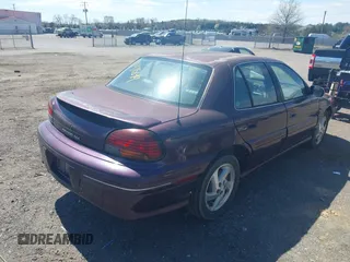 1998 Pontiac Grand Am SE with VIN 1G2NE52M1WC783104, listed as a IAAI auction lot 41911849 with 234,503 mi miles. Bid and sale history available at carsss.com. Image 4.