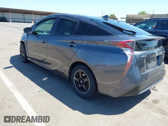 2016 Toyota Prius Two z VIN JTDKBRFU1G3521884, wystawiony jako IAAI lot #42081852 z przebiegiem 93 107 mil mil oraz . Historia ofert i sprzedaży dostępna na DreamBid. Obrazek 3.