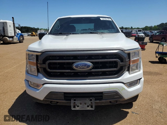 2021 Ford F-150 XL with VIN 1FTFW1E59MFD09567, listed as a Copart auction lot 52706195 with 104,716 mi miles and Salvage Title. Bid and sale history available at carsss.com. Image 5.