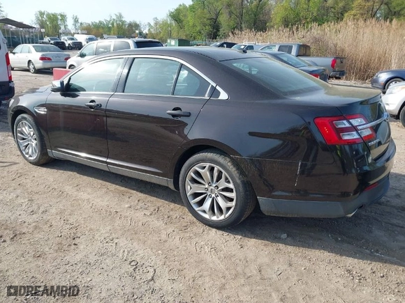 2013 Ford Taurus Limited with VIN 1FAHP2F85DG188511, listed as a IAAI auction lot 42077614 with 165,059 mi miles. Bid and sale history available at carsss.com. Image 3.