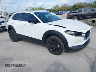 2022 Mazda CX-30 2.5 Turbo Premium Package with VIN 3MVDMBDY3NM437897, listed as a IAAI auction lot 41715776 with 42,771 mi miles. Bid and sale history available at carsss.com. Image 1.