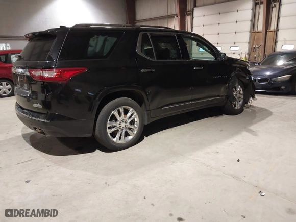 2021 Chevrolet Traverse High Country with VIN 1GNEVNKW9MJ150993, listed as a IAAI auction lot 41224329 with 100,425 mi miles. Bid and sale history available at carsss.com. Image 4.