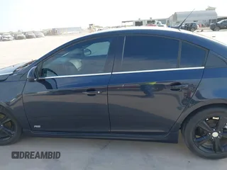 2014 Chevrolet Cruze 2LT z VIN 1G1PE5SB3E7255292, wystawiony jako IAAI lot #41851205 z przebiegiem 141 659 mil mil oraz . Historia ofert i sprzedaży dostępna na DreamBid. Obrazek 14.