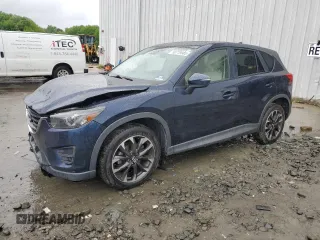 2016 Mazda CX-5 Grand Touring z VIN JM3KE4DY0G0706453, wystawiony jako Copart lot #56779985 z przebiegiem 103 547 mil mil oraz Szkoda całkowita • Salvage title. Historia ofert i sprzedaży dostępna na DreamBid. Obrazek 1.