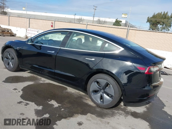 2019 Tesla Model 3 Mid Range with VIN 5YJ3E1EA2KF305834, listed as a IAAI auction lot 41719610 with 126,333 mi miles and . Bid and sale history available at DreamBid. Image 3.