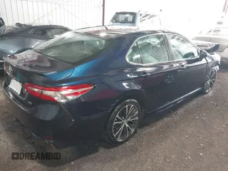 2018 Toyota Camry LE z VIN 4T1B11HK8JU517019, wystawiony jako IAAI lot #42220646 z przebiegiem 98 924 mil mil oraz . Historia ofert i sprzedaży dostępna na DreamBid. Obrazek 4.