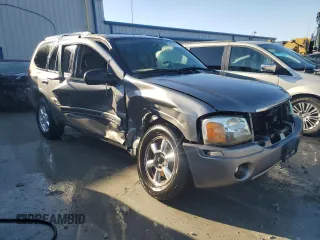 2005 GMC Envoy SLT with VIN 1GKDS13SX52322725, listed as a Copart auction lot 82032674 with 249,288 mi miles and Salvage Title. Bid and sale history available at carsss.com. Image 4.