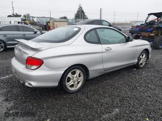 2001 Hyundai Tiburon with VIN KMHJG25F81U267658, listed as a IAAI auction lot 41092438 with 188,575 mi miles. Bid and sale history available at carsss.com. Image 4.