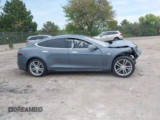 2013 Tesla Model S with VIN 5YJSA1CG9DFP27357, listed as a IAAI auction lot 42362514 with Not provided miles and . Bid and sale history available at DreamBid. Image 13.