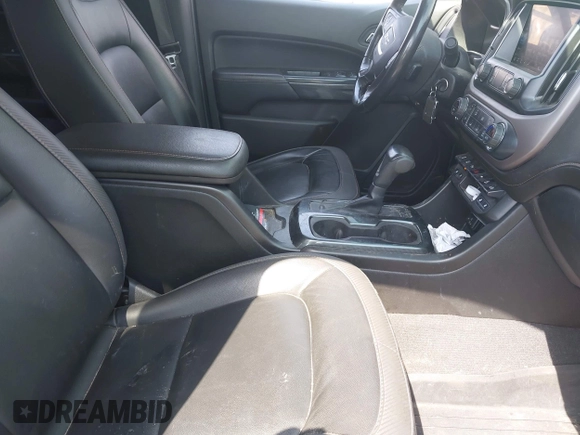 2021 GMC Canyon 4WD AT4 z VIN 1GTG6FENXM1291689, wystawiony jako IAAI lot #42038884 z przebiegiem 54 884 mil mil oraz . Historia ofert i sprzedaży dostępna na DreamBid. Obrazek 5.