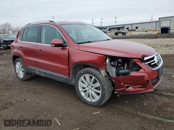 2011 Volkswagen Tiguan SE with VIN WVGBV7AXXBW001845, listed as a Copart auction lot 52414935 with 256,311 mi miles and Salvage Title. Bid and sale history available at DreamBid. Image 4.