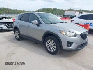 2014 Mazda CX-5 Touring z VIN JM3KE4CY7E0411414, wystawiony jako IAAI lot #42106752 z przebiegiem 227 182 mil mil oraz . Historia ofert i sprzedaży dostępna na DreamBid. Obrazek 1.