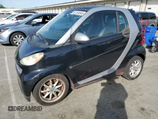 2009 Smart fortwo Pure z VIN WMEEJ31X39K211342, wystawiony jako Copart lot #54104045 z przebiegiem 46 162 mil mil oraz Tytuł czysty. Historia ofert i sprzedaży dostępna na DreamBid. Obrazek 1.