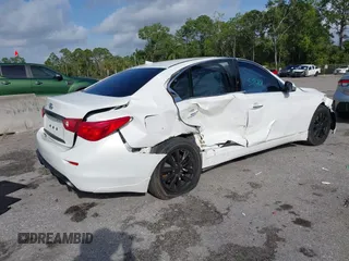 2015 Infiniti Q50 Premium z VIN JN1BV7AR5FM415612, wystawiony jako IAAI lot #41726943 z przebiegiem 120 534 mil mil oraz . Historia ofert i sprzedaży dostępna na DreamBid. Obrazek 4.