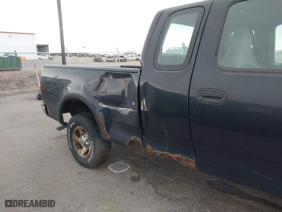 1999 Ford F-150 Work Series with VIN 1FTRX18W2XNA90069, listed as a IAAI auction lot 41496543 with 115,787 mi miles. Bid and sale history available at carsss.com. Image 6.