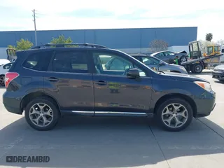 2015 Subaru Forester 2.5i Touring with VIN JF2SJAWC4FH523997, listed as a IAAI auction lot 41884674 with 175,127 mi miles. Bid and sale history available at carsss.com. Image 14.