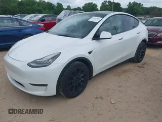 2021 Tesla Model Y Long Range with VIN 5YJYGDEE7MF198867, listed as a IAAI auction lot 42117463 with 79,759 mi miles and . Bid and sale history available at DreamBid. Image 2.