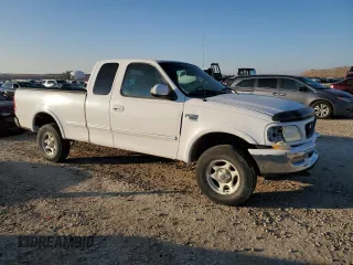 1998 Ford F-150 z VIN 1FTZX18W3WKB01774, wystawiony jako Copart lot #88670315 z przebiegiem 102 301 mil mil oraz Szkoda całkowita • Salvage title. Historia ofert i sprzedaży dostępna na DreamBid. Obrazek 4.