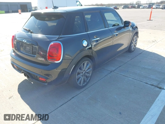 2015 MINI Hardtop 4 Door S with VIN WMWXU3C57FT892179, listed as a IAAI auction lot 42092010 with 95,156 mi miles and . Bid and sale history available at DreamBid. Image 4.