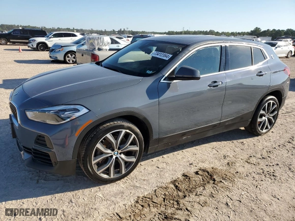 2021 BMW X2 xDrive28i with VIN WBXYJ1C04M5S07696, listed as a Copart auction lot 73412384 with 35,004 mi miles and Salvage Title. Bid and sale history available at carsss.com. Image 1.