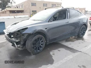 2021 Tesla Model Y Long Range with VIN 5YJYGAEE0MF223140, listed as a IAAI auction lot 42007701 with 55,308 mi miles. Bid and sale history available at carsss.com. Image 2.