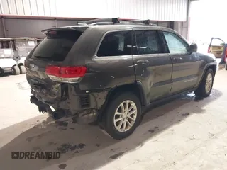 2014 Jeep Grand Cherokee Laredo with VIN 1C4RJEAG7EC145023, listed as a IAAI auction lot 40518825 with 115,098 mi miles and . Bid and sale history available at DreamBid. Image 4.