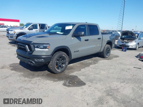 2023 Ram 1500 Rebel with VIN 1C6SRFLT2PN677577, listed as a IAAI auction lot 41991668 with 20,507 mi miles and . Bid and sale history available at DreamBid. Image 2.
