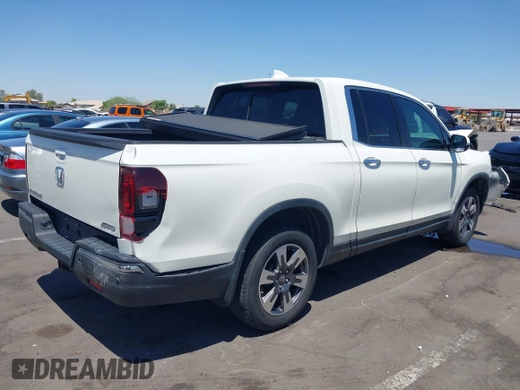 2019 Honda Ridgeline RTL-E with VIN 5FPYK3F74KB009279, listed as a IAAI auction lot 42348773 with 98,141 mi miles and . Bid and sale history available at DreamBid. Image 4.