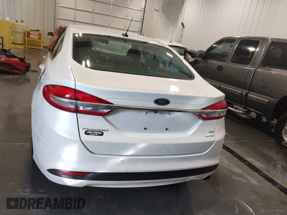 2018 Ford Fusion SE z VIN 3FA6P0HD9JR231970, wystawiony jako IAAI lot #41549490 z przebiegiem 99 803 mil mil oraz . Historia ofert i sprzedaży dostępna na DreamBid. Obrazek 16.