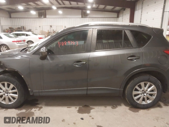 2015 Mazda CX-5 Touring with VIN JM3KE4CY3F0460501, listed as a IAAI auction lot 41889743 with 160,367 mi miles. Bid and sale history available at carsss.com. Image 14.