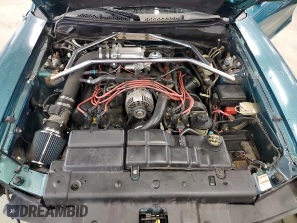 1996 Ford Mustang GT z VIN 1FALP42X5TF191769, wystawiony jako Copart lot #49364525 z przebiegiem 69 029 mil mil oraz Szkoda całkowita • Salvage title. Historia ofert i sprzedaży dostępna na DreamBid. Obrazek 11.