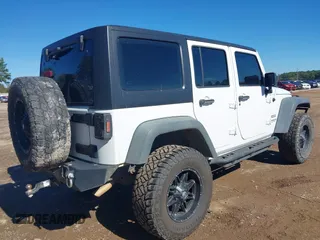 2017 Jeep Wrangler Unlimited Sport with VIN 1C4BJWDG4HL502861, listed as a IAAI auction lot 40895010 with 62,970 mi miles. Bid and sale history available at carsss.com. Image 4.