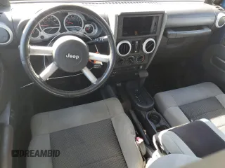 2010 Jeep Wrangler Unlimited Sahara with VIN 1J4BA5H19AL171369, listed as a Copart auction lot 50412855 with 152,742 mi miles and Salvage Title. Bid and sale history available at carsss.com. Image 8.