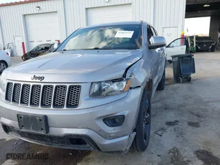 2015 Jeep Grand Cherokee Altitude with VIN 1C4RJFAG3FC210151, listed as a IAAI auction lot 41865151 with 122,579 mi miles. Bid and sale history available at carsss.com. Image 2.