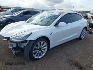2019 Tesla Model 3 Long Range with VIN 5YJ3E1EBXKF512710, listed as a IAAI auction lot 42063737 with 90,721 mi miles and . Bid and sale history available at DreamBid. Image 20.