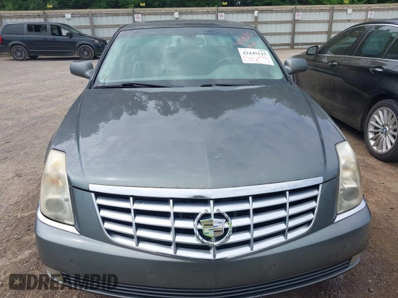 2006 Cadillac DTS 1SC z VIN 1G6KD57Y76U244707, wystawiony jako IAAI lot #42445115 z przebiegiem 189 119 mil mil oraz . Historia ofert i sprzedaży dostępna na DreamBid. Obrazek 6.