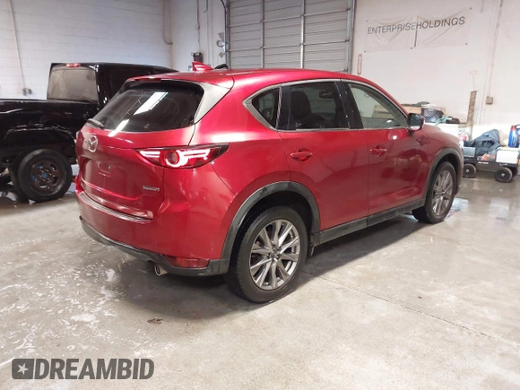 2020 Mazda CX-5 Grand Touring with VIN JM3KFBDM1L1809951, listed as a IAAI auction lot 41345854 with 117,376 mi miles. Bid and sale history available at carsss.com. Image 4.