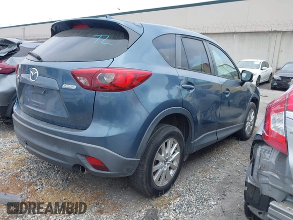 2016 Mazda CX-5 Touring z VIN JM3KE2CY2G0699138, wystawiony jako IAAI lot #42153228 z przebiegiem 144 191 mil mil oraz . Historia ofert i sprzedaży dostępna na DreamBid. Obrazek 4.