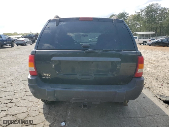 2004 Jeep Grand Cherokee Laredo with VIN 1J4GW48S44C100529, listed as a Copart auction lot 51022405 with 169,966 mi miles and Clean Title. Bid and sale history available at carsss.com. Image 6.