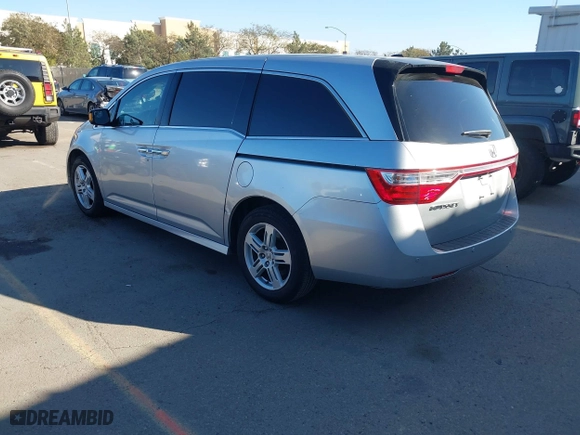 2011 Honda Odyssey Touring with VIN 5FNRL5H9XBB012899, listed as a IAAI auction lot 41611879 with 171,041 mi miles. Bid and sale history available at carsss.com. Image 3.