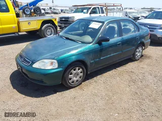 1999 Honda Civic VP with VIN 2HGEJ6611XH540017, listed as a IAAI auction lot 42093222 with 154,261 mi miles. Bid and sale history available at carsss.com. Image 2.