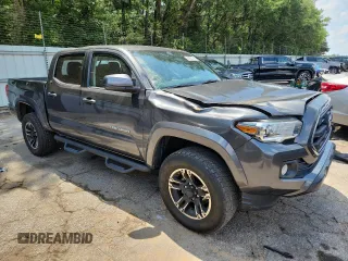 2017 Toyota Tacoma SR5 with VIN 3TMAZ5CNXHM044286, listed as a Copart auction lot 61455145 with 112,079 mi miles and Salvage title. Bid and sale history available at DreamBid. Image 4.