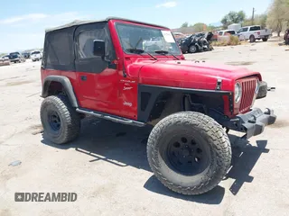 2000 Jeep Wrangler Sport with VIN 1J4FA49S0YP731544, listed as a IAAI auction lot 42570831 with Not provided miles and . Bid and sale history available at DreamBid. Image 1.