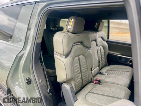 2023 Rivian R1S Launch Edition with VIN 7PDSGABL2PN003733, listed as a Copart auction lot 56033315 with 9,996 mi miles and Salvage Title. Bid and sale history available at carsss.com. Image 6.