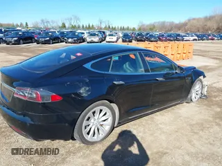 2016 Tesla Model S 90D with VIN 5YJSA1E22GF174301, listed as a IAAI auction lot 38867108 with 60,715 mi miles and . Bid and sale history available at DreamBid. Image 4.